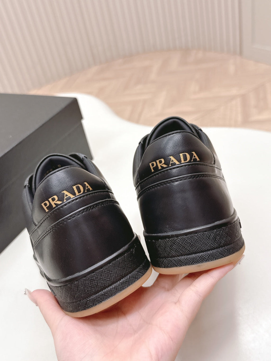 PRADA 25S DOWNTOWN SNEAKERS IN BLACK CALFSKIN