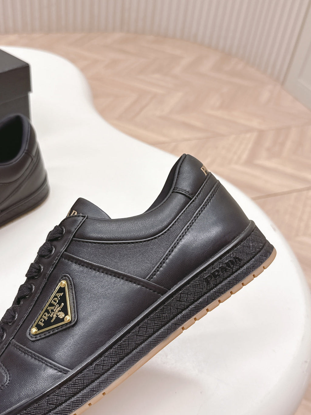 PRADA 25S DOWNTOWN SNEAKERS IN BLACK CALFSKIN