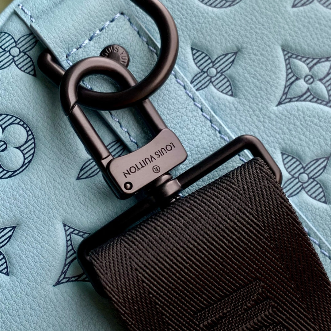 KEEPALL BANDOULIÈRE 50 IN SKY BLUE MONOGRAM SHADOW EMBOSSED CALFSKIN