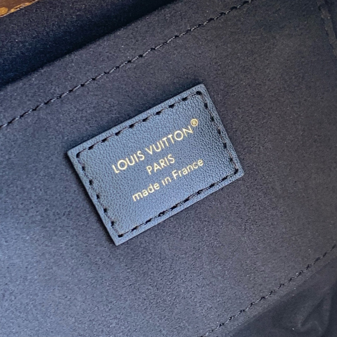 THE DROP PM 28 IN BROWN MONOGRAM COATED CANVAS AND CALFSKIN