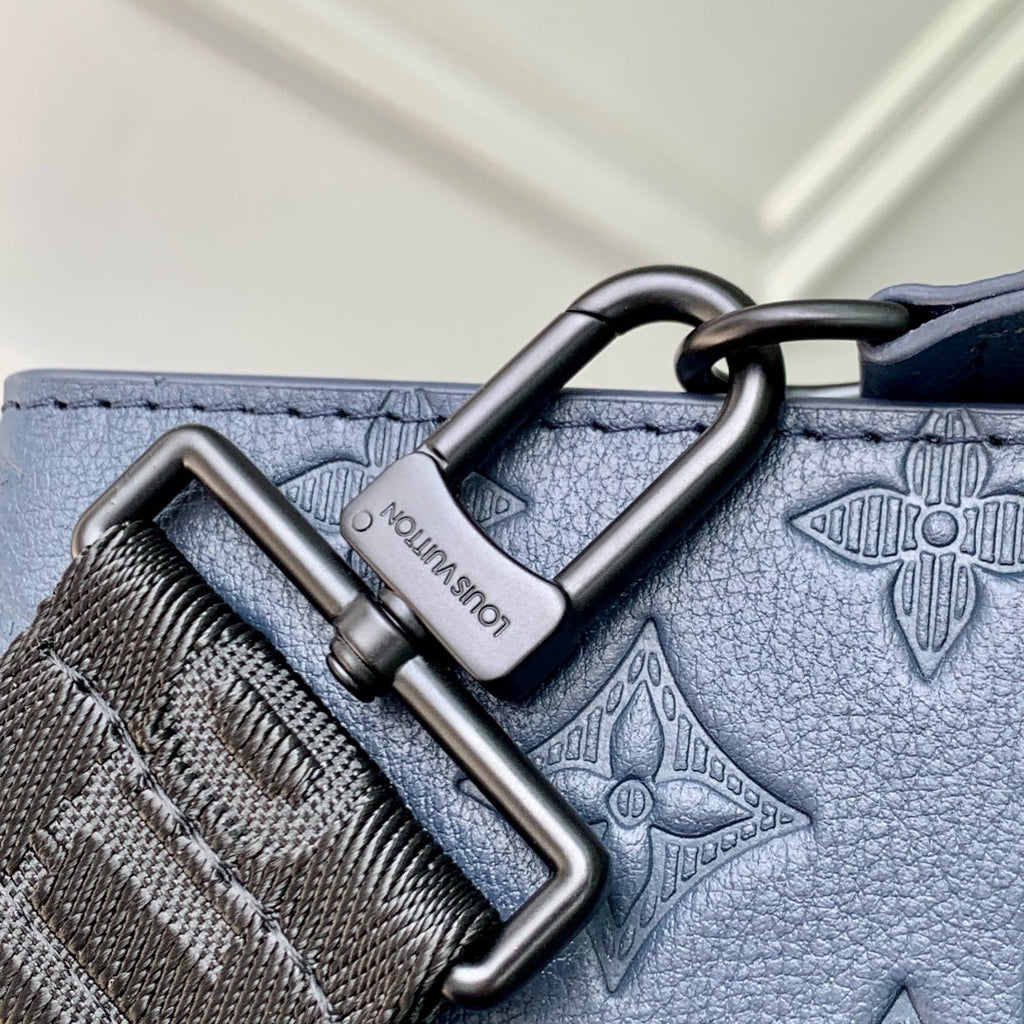 POCHETTE VOYAGE 22 IN DARK BLUE MONOGRAM SHADOW CALFSKIN