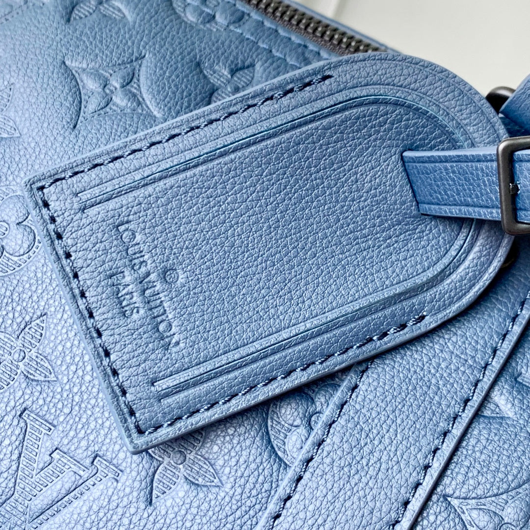 KEEPALL BANDOULIÈRE 50 IN DARK BLUE MONOGRAM SHADOW EMBOSSED CALFSKIN