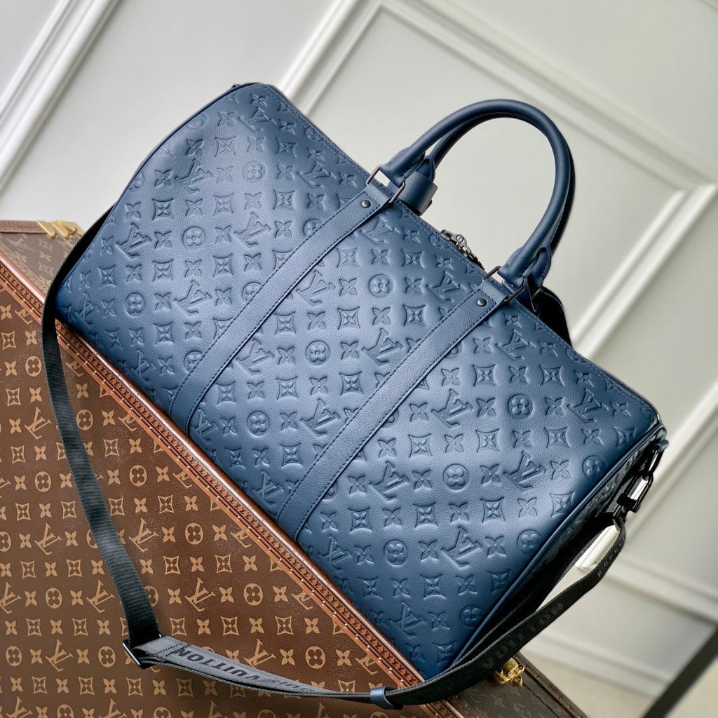 KEEPALL BANDOULIÈRE 50 IN DARK BLUE MONOGRAM SHADOW EMBOSSED CALFSKIN