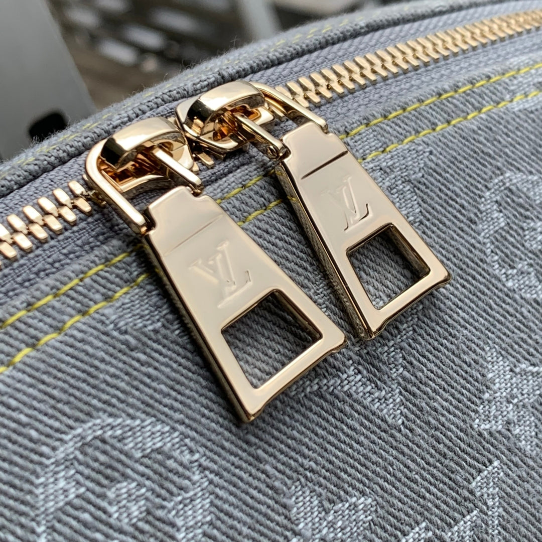 COSMETIC POUCH 27 IN GREY MONOGRAM DENIM GOLD HARDWARE