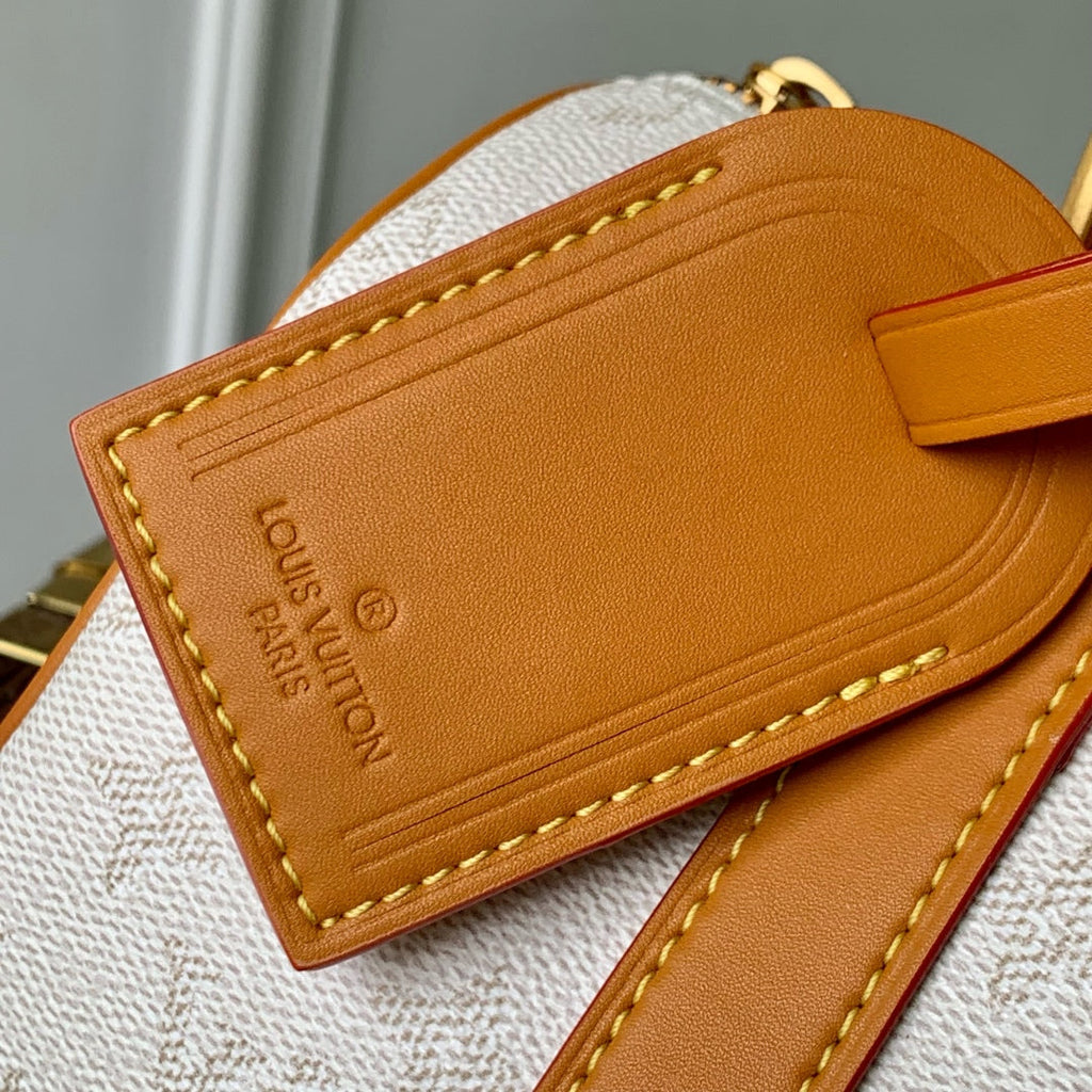 KEEPALL BANDOULIÈRE 25 IN WHITE MONOGRAM HERITAGE CANVAS BRWON CALFSKIN