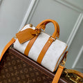 KEEPALL BANDOULIÈRE 25 IN WHITE MONOGRAM HERITAGE CANVAS BRWON CALFSKIN