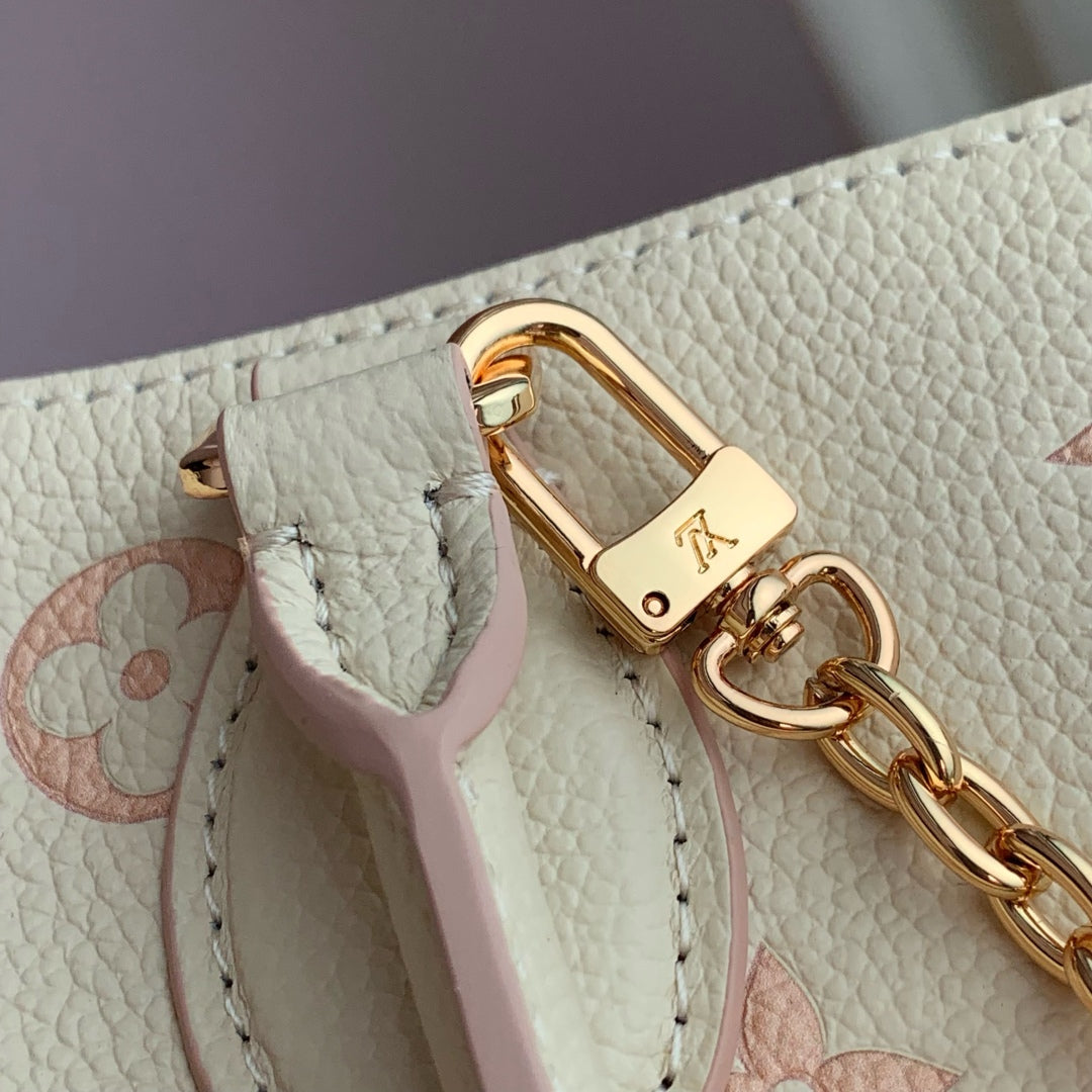 ONTHEGO 25 IN CREAM MONOGRAM EMPREINTE CALFSKIN EMBOSSED LOGO