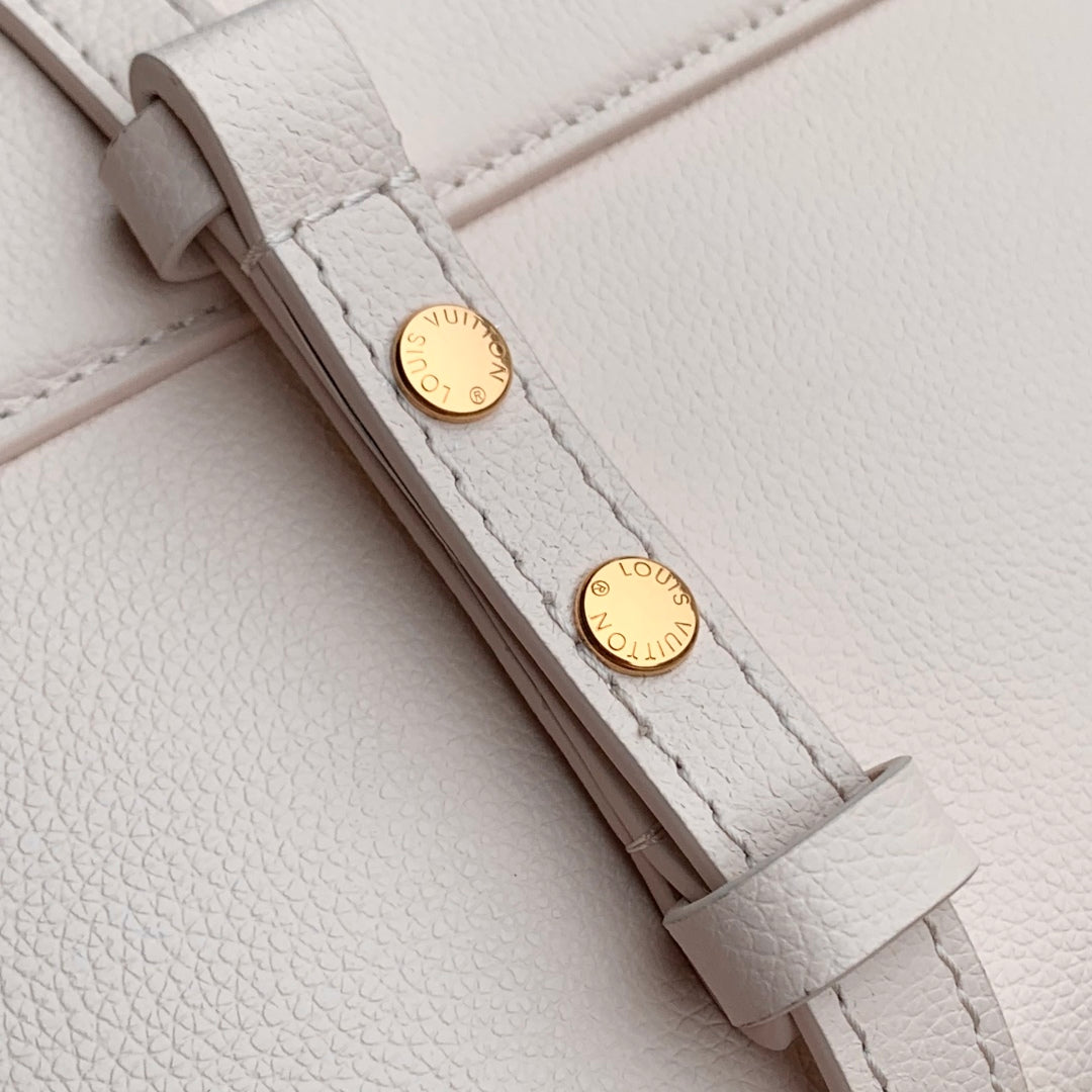 TWIST SLIM 19 IN LIGHT PINK TAURILLON CALFSKIN GOLD HARDWARE