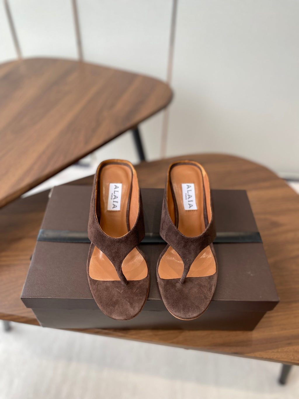 ALAIA WEDGE THONG SANDALS 25S IN BROWN SUEDE