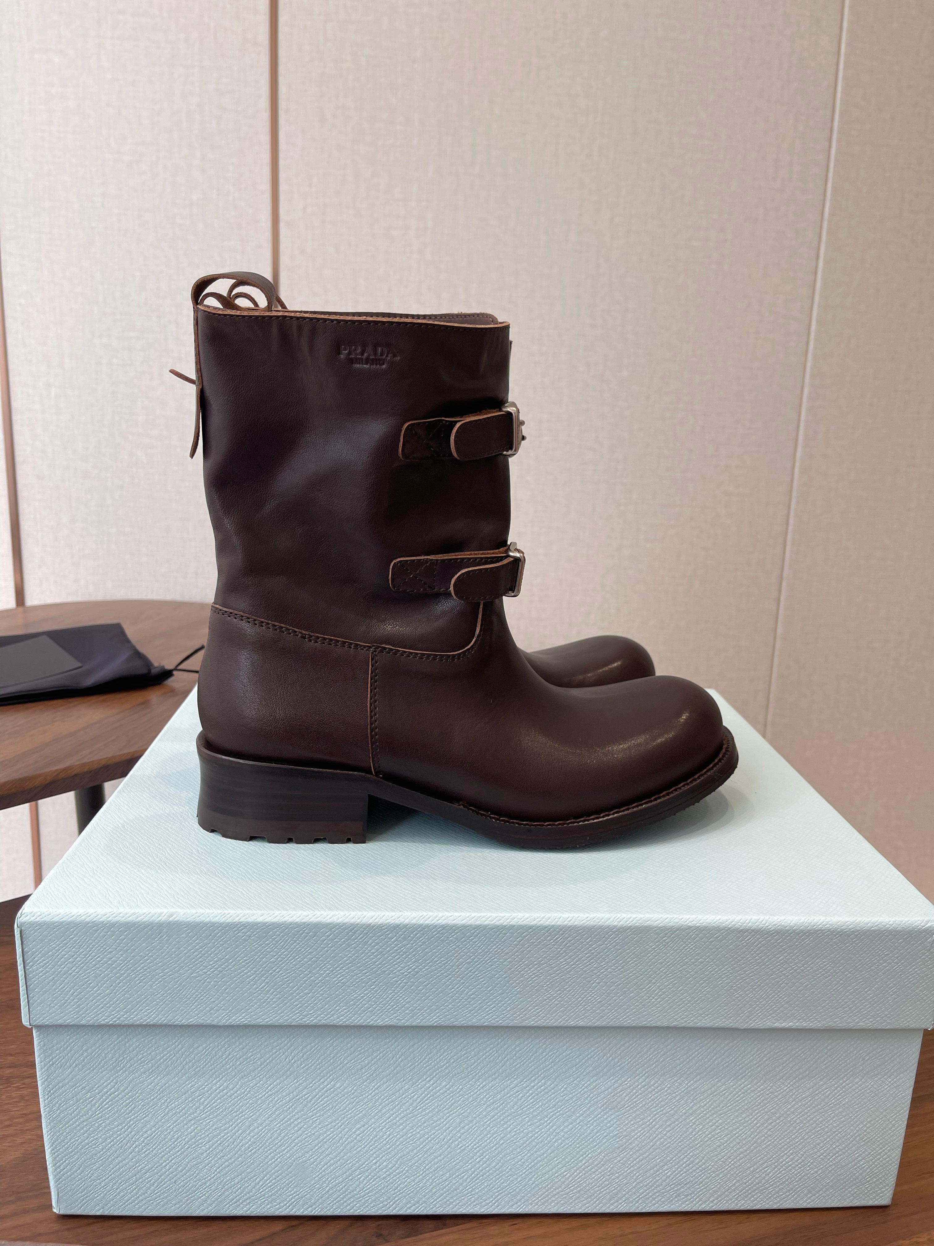 PRADA 25S TWO-BUTTON COWBOY BOOTS IN DARK BROWN CALFSKIN WITH SILVER HARDWARE