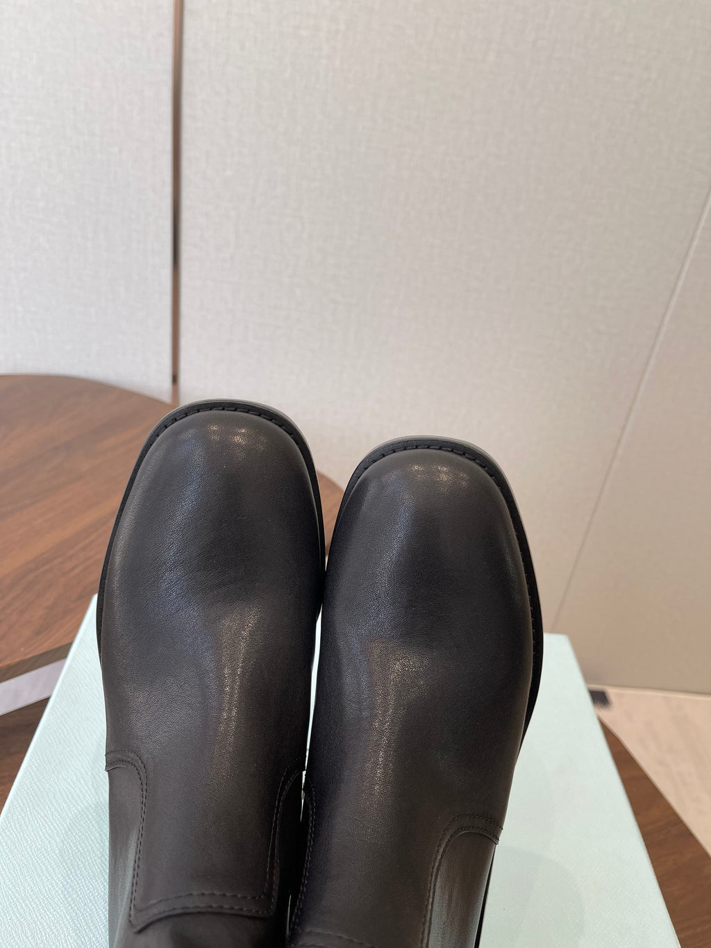 PRADA 25S COWBOY BOOTS IN DARK BLACK-BROWN CALFSKIN