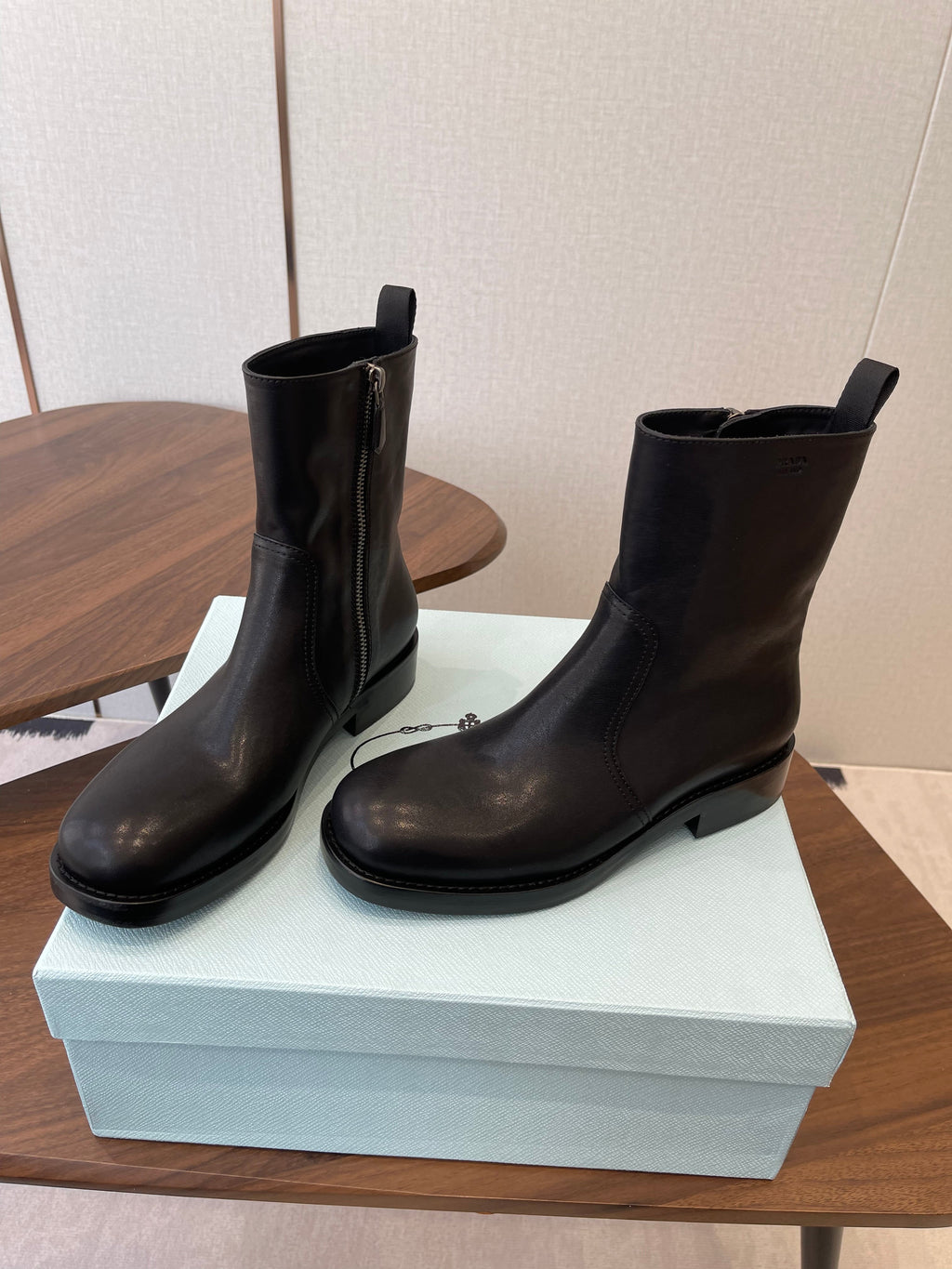 PRADA 25S COWBOY BOOTS IN DARK BLACK-BROWN CALFSKIN