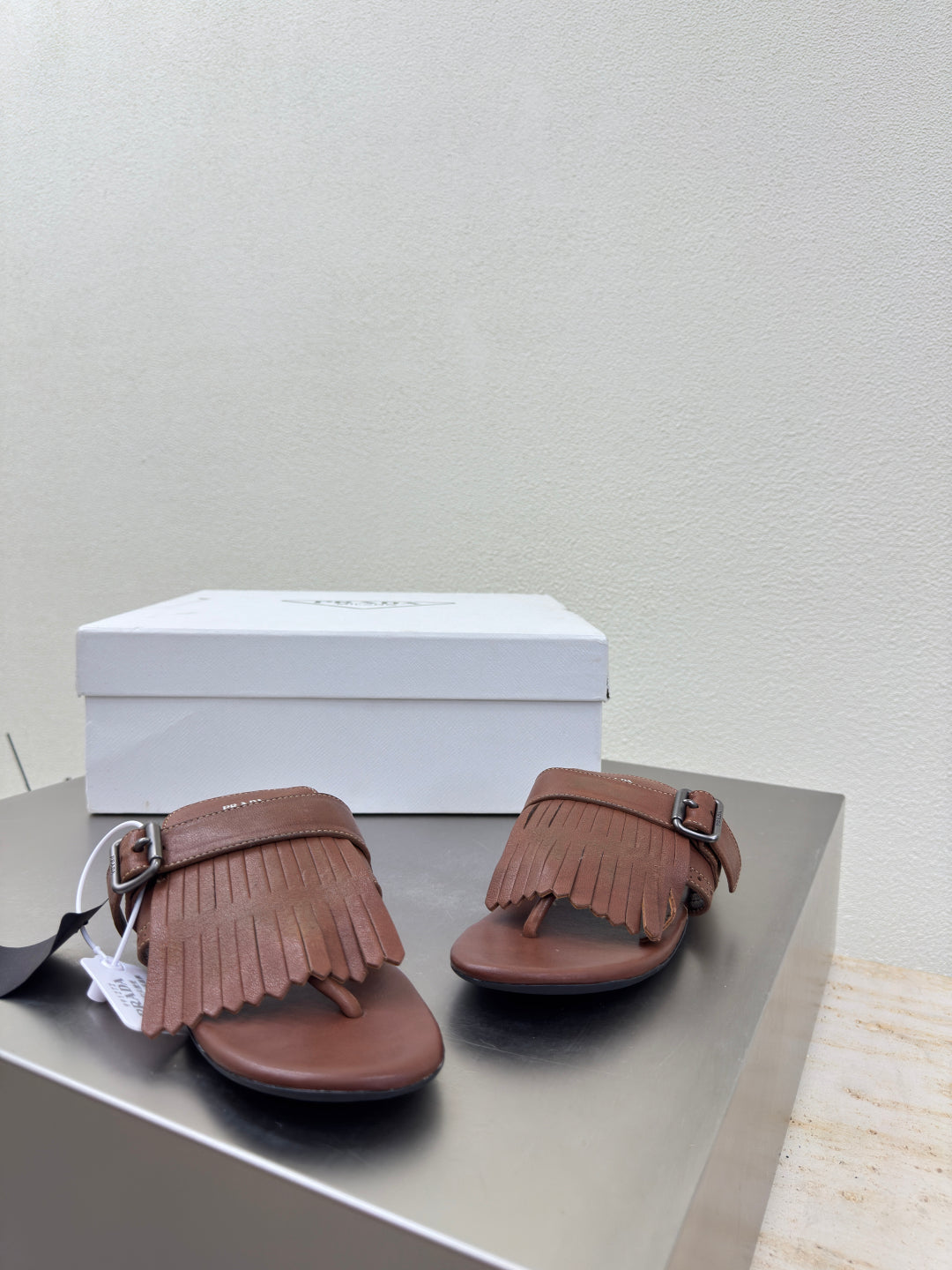 PRADA 25S SHUFFLE LEATHER THONG SANDALS IN SIENNA CALFSKIN