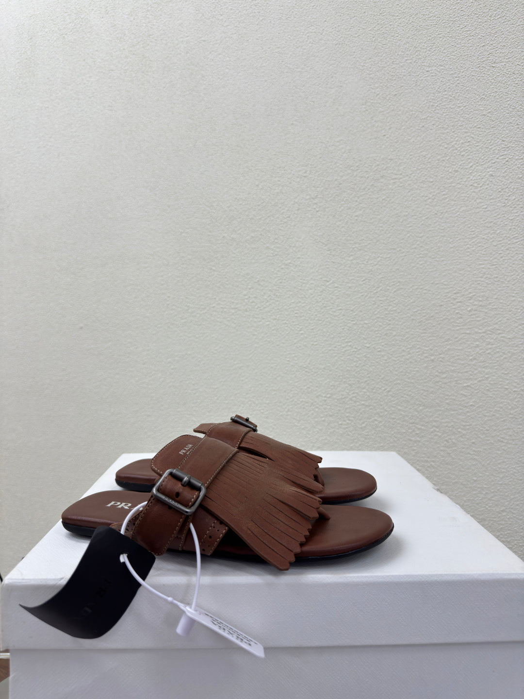 PRADA 25S SHUFFLE LEATHER THONG SANDALS IN SIENNA CALFSKIN