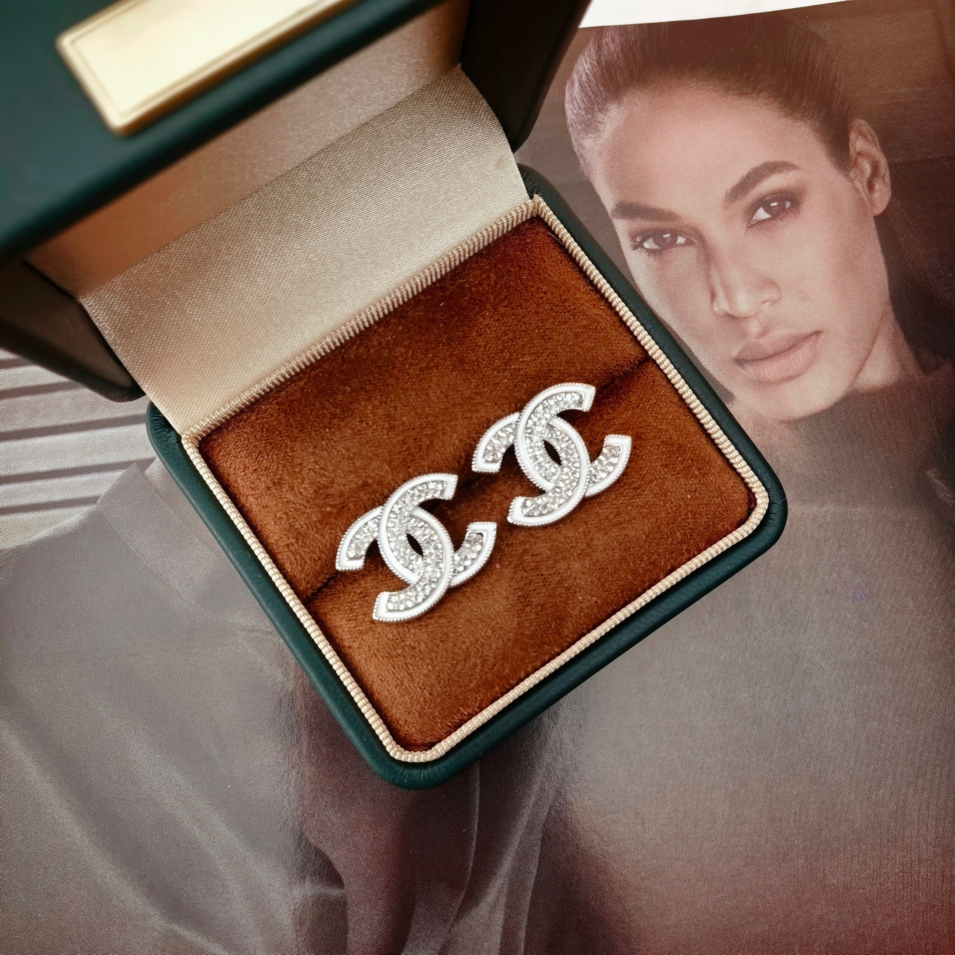 DOUBLE C STUD EARRINGS WITH WHITE TRIM AND CLEAR STONE LOGO