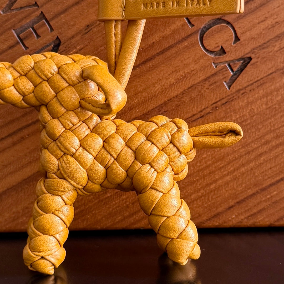 BOTTEGA VENETA 25S DOG CHARM IN BURNT ORANGE CALFSKIN