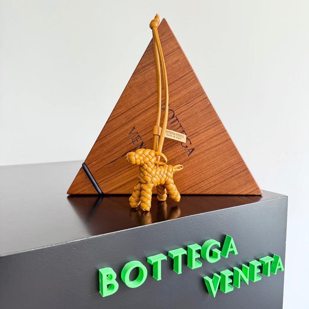 BOTTEGA VENETA 25S DOG CHARM IN BURNT ORANGE CALFSKIN