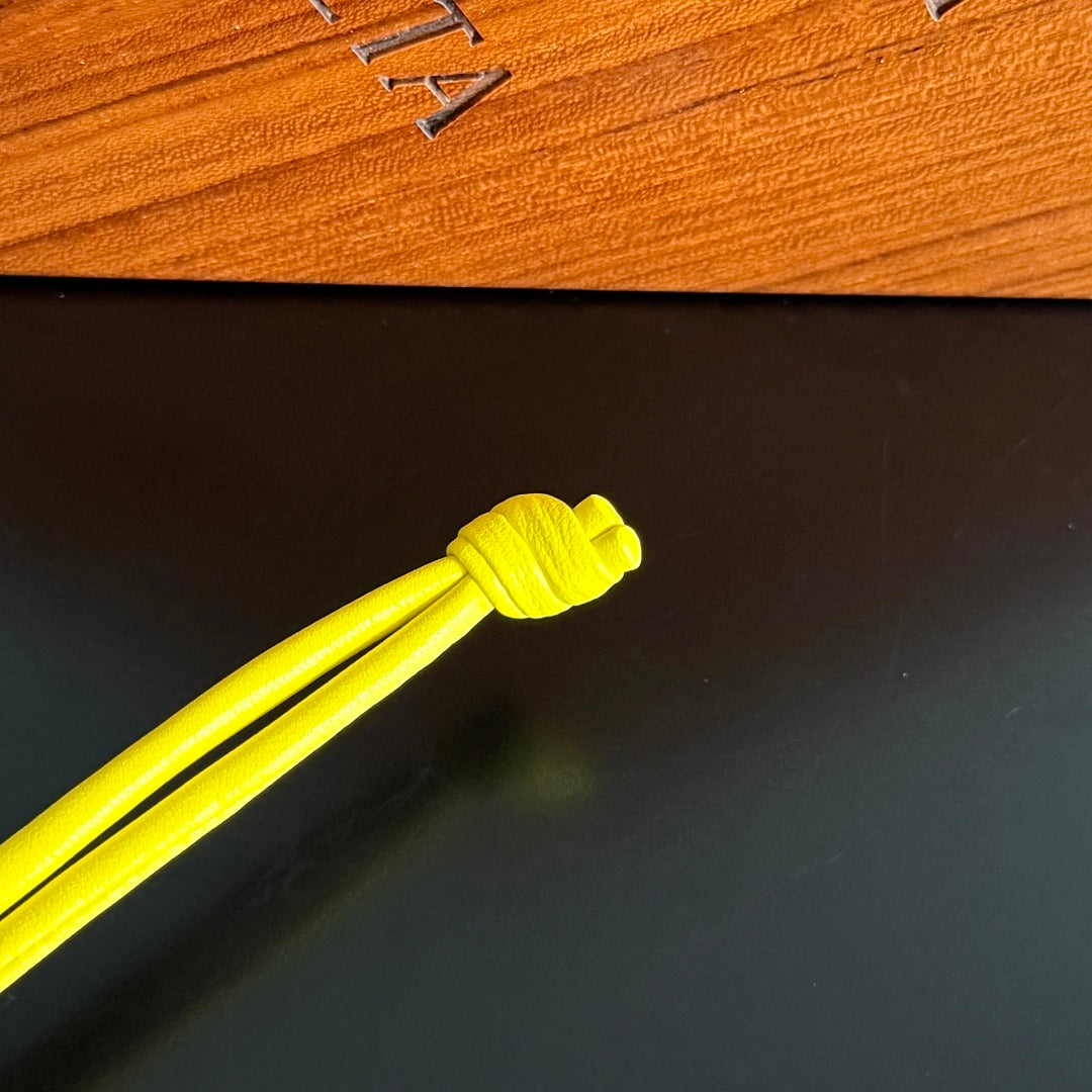 BOTTEGA VENETA 25S DOG CHARM IN LEMON YELLOW CALFSKIN