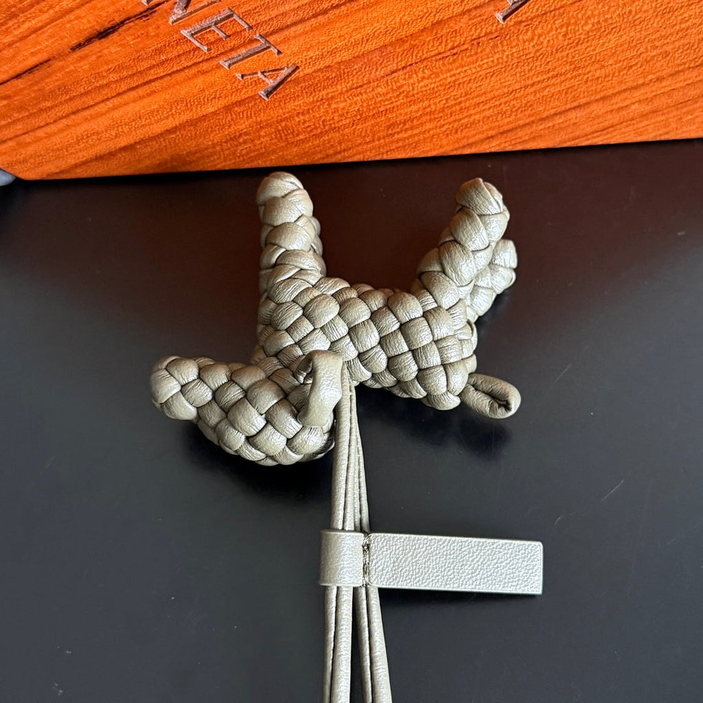 BOTTEGA VENETA 25S DOG CHARM IN GREIGE CALFSKIN