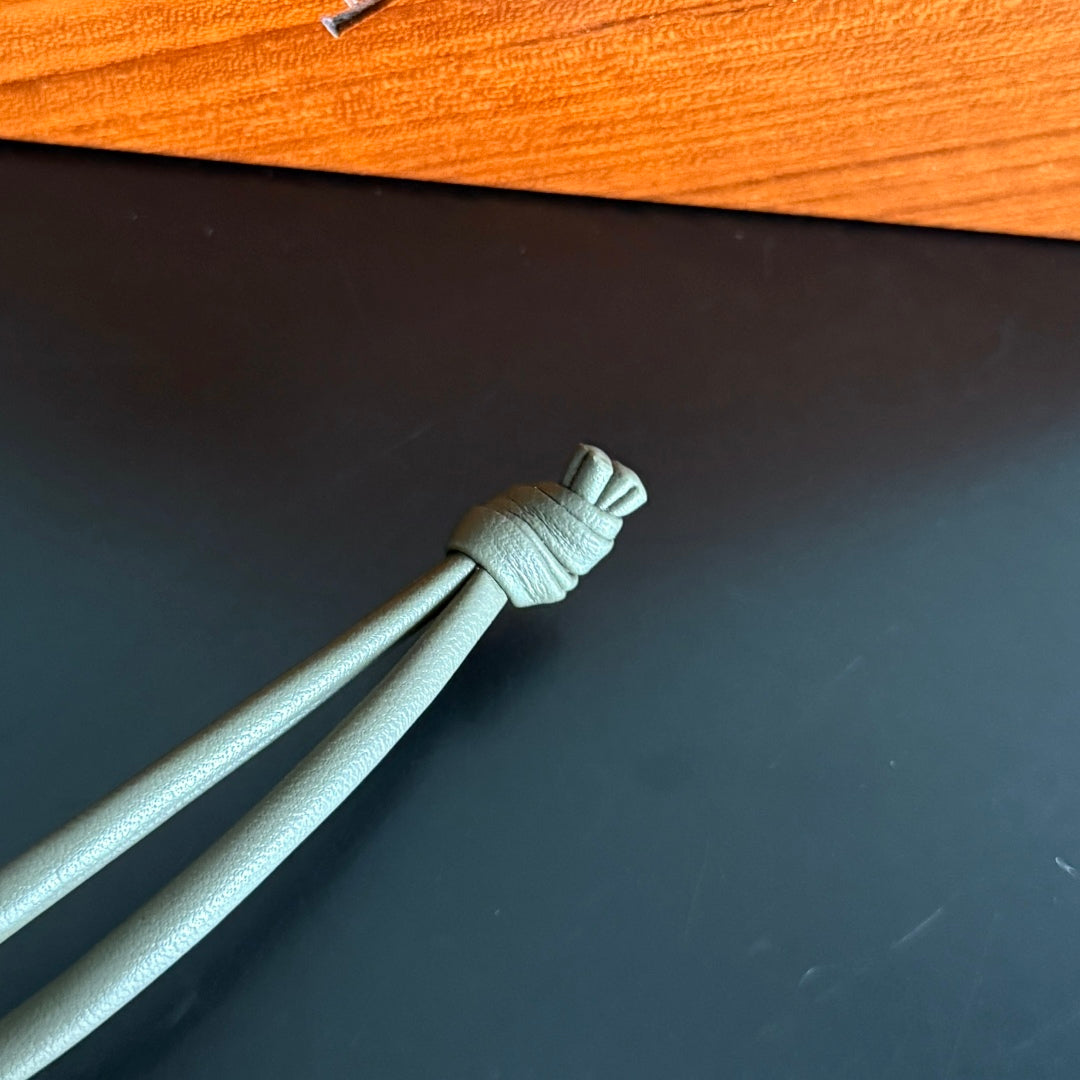 BOTTEGA VENETA 25S DOG CHARM IN GREIGE CALFSKIN