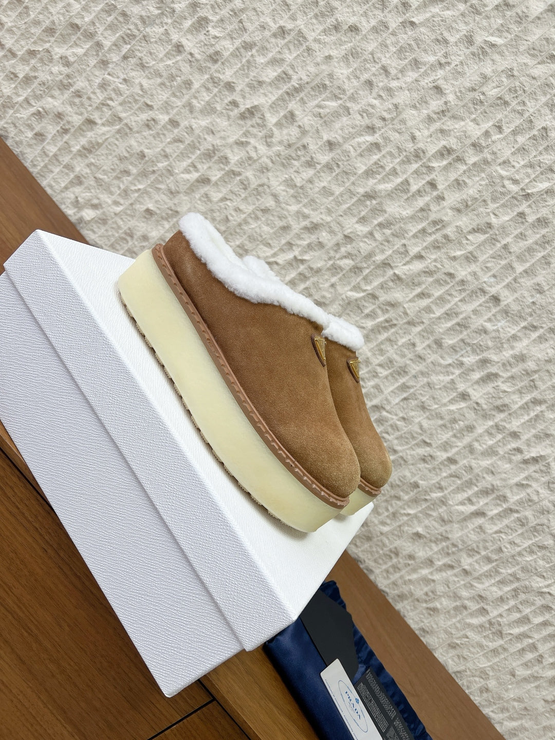 PRADA 25S PLATFORM FUR-LINED MULES IN BROWN SUEDE