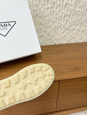 PRADA 25S PLATFORM FUR-LINED MULES IN BLACK SUEDE