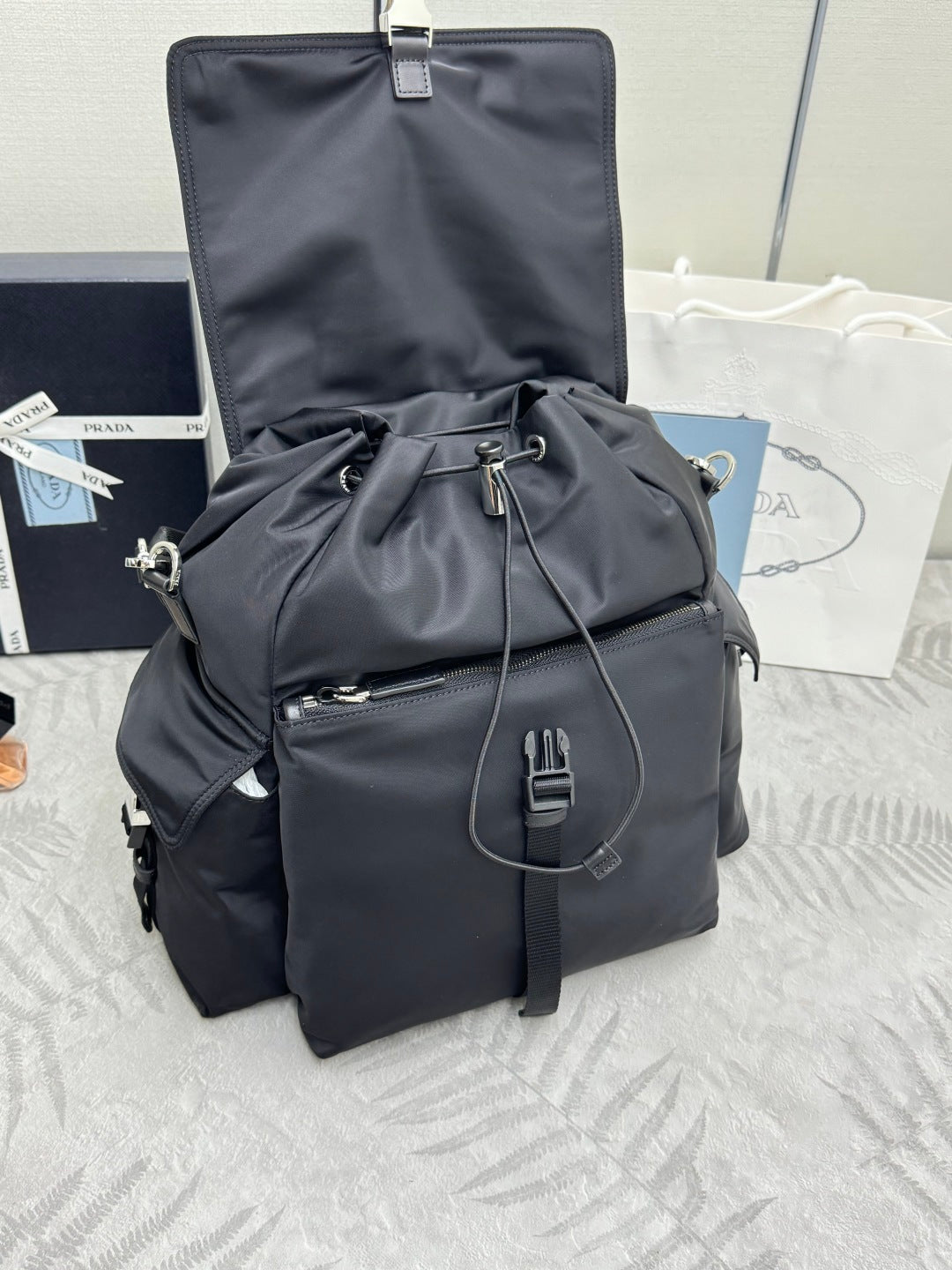 PRADA 25S EXPLORE BACKPACK 39 IN BLACK RE-NYLON AND CALFSKIN