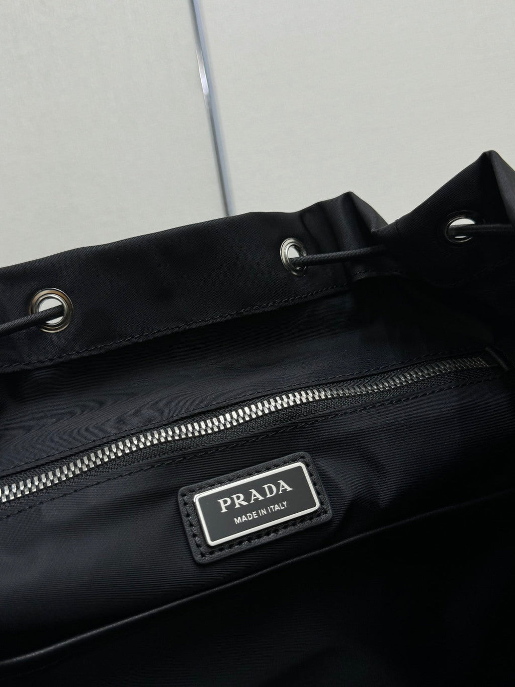 PRADA 25S EXPLORE BACKPACK 39 IN BLACK RE-NYLON AND CALFSKIN