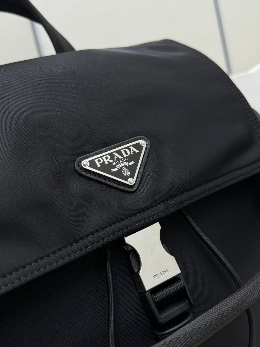 PRADA 25S EXPLORE BACKPACK 39 IN BLACK RE-NYLON AND CALFSKIN