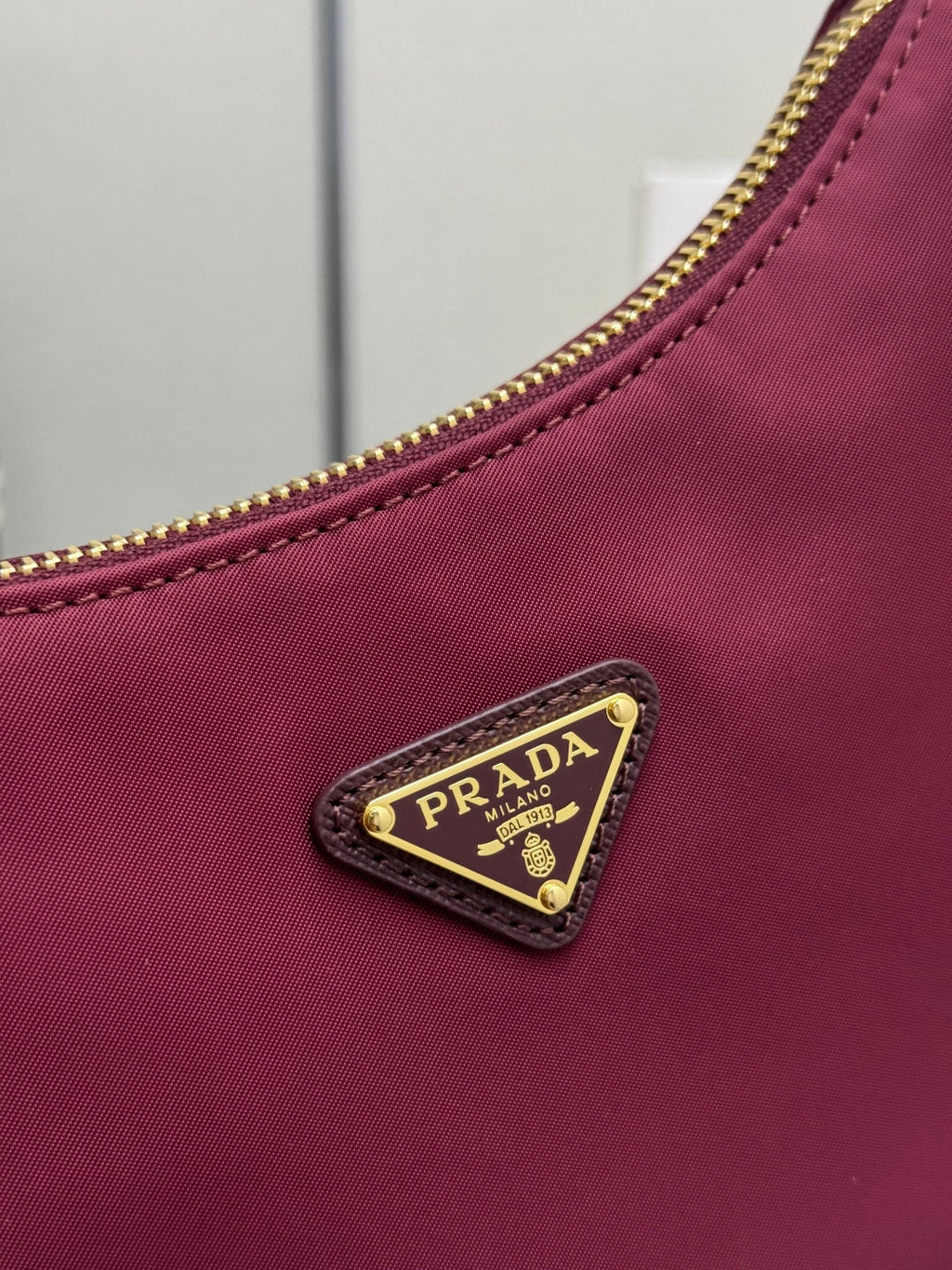 PRADA 25S RE-EDITION 2005 MINI BAG 22 IN BURGUNDY RE-NYLON AND SAFFIANO