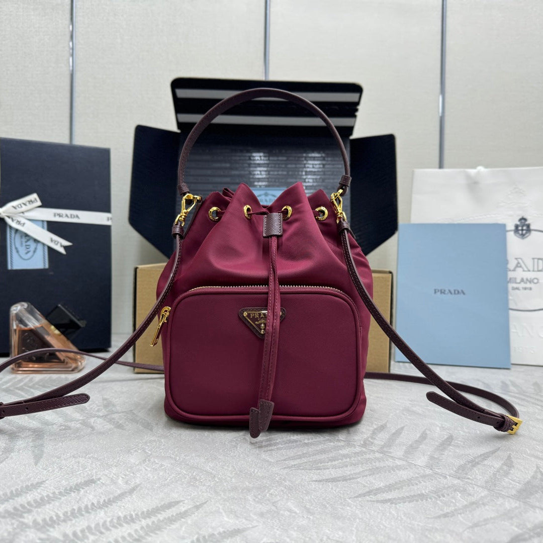 PRADA 25S DUET BUCKET BAG 23 IN BURGUNDY RE-NYLON GOLD HARDWRE