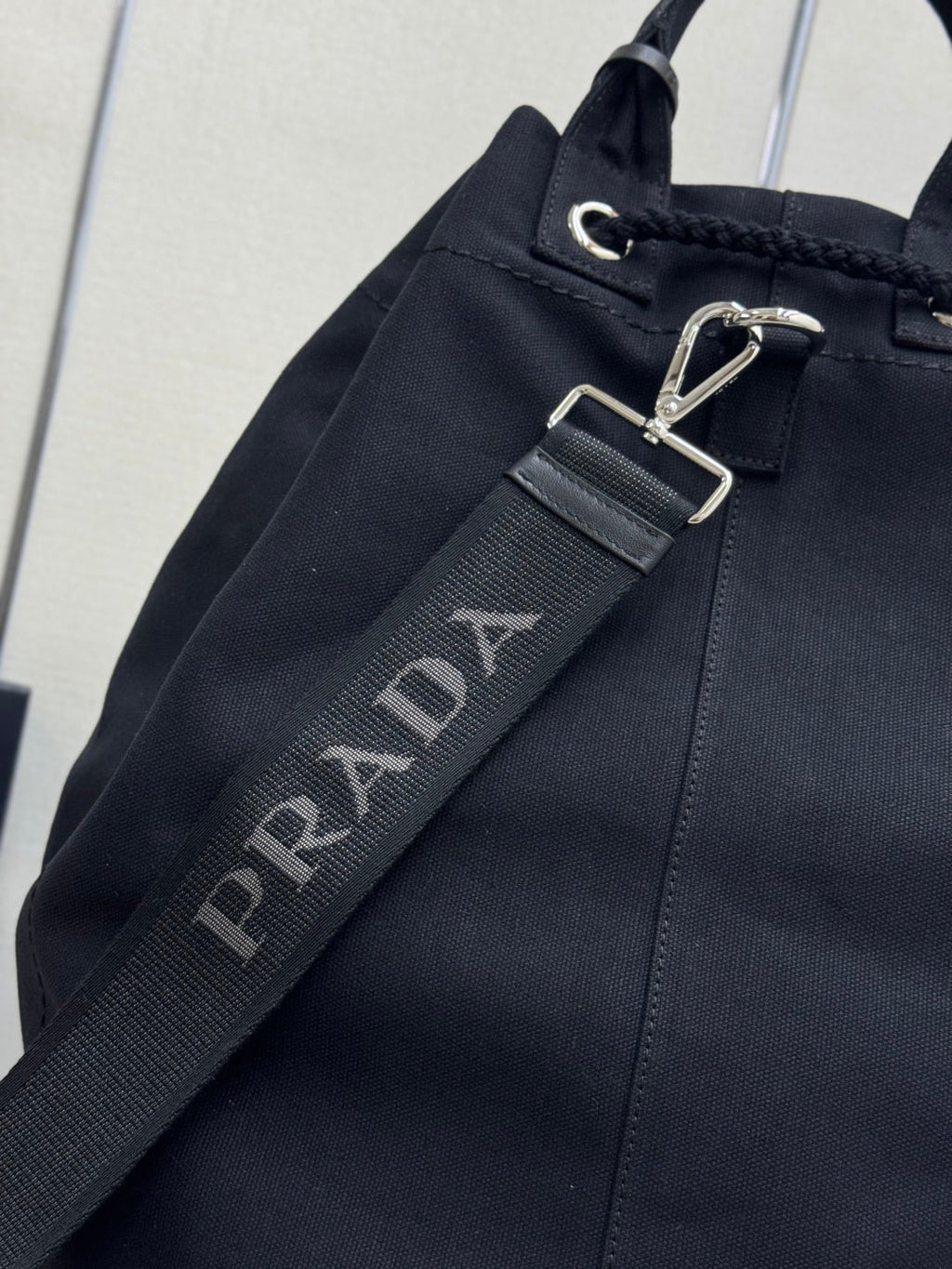 PRADA 25S DRAWSTRING BACKPACK 55 IN BLACK CANVAS LINEN SILVER HARDWRE