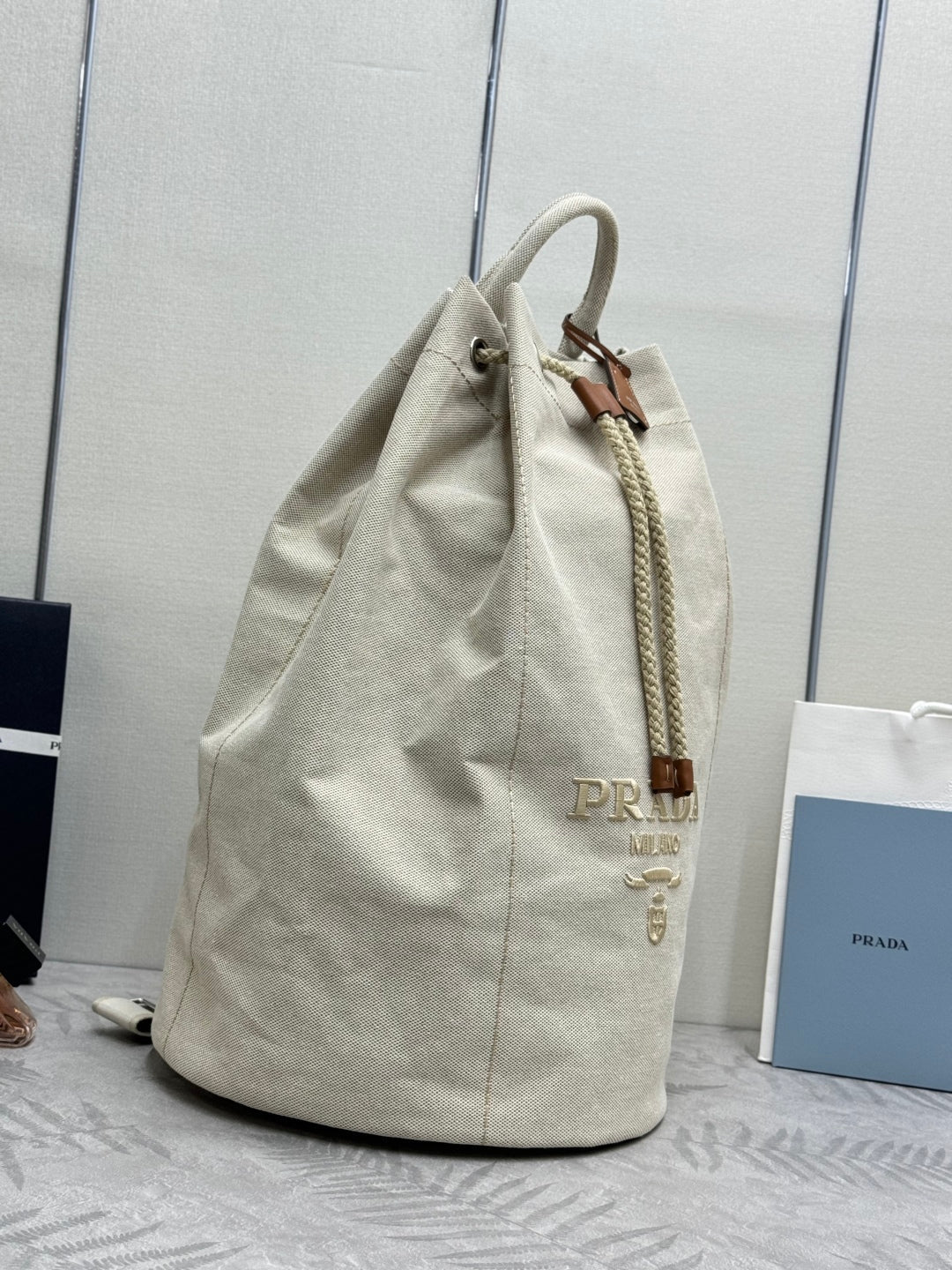 PRADA 25S DRAWSTRING BACKPACK 55 IN BEIGE CANVAS LINEN SILVER HARDWRE