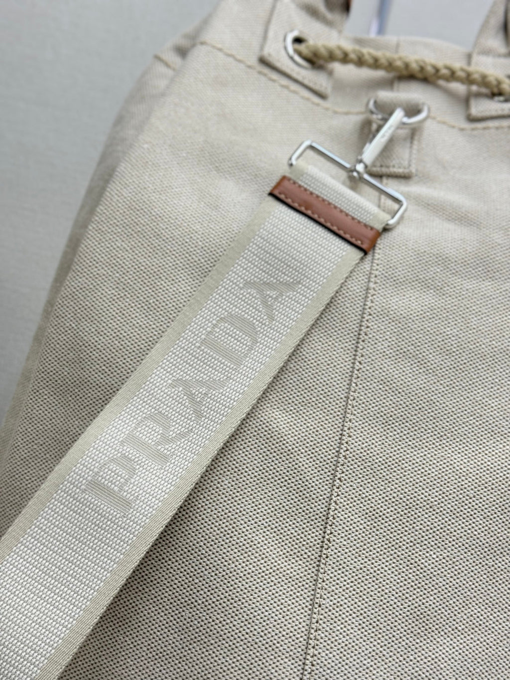 PRADA 25S DRAWSTRING BACKPACK 55 IN BEIGE CANVAS LINEN SILVER HARDWARE