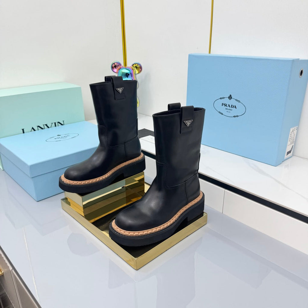 PRADA 25S HIGH MARTIN BOOTS 50MM IN BLACK CALFSKIN