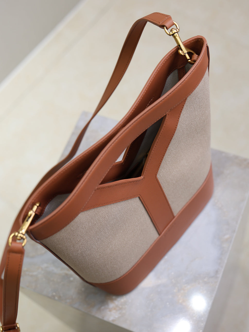 YSL 25S Y SMALL BUCKET 29 IN DESERT DUST AND BRICK CANVAS GOLD HARDWARE