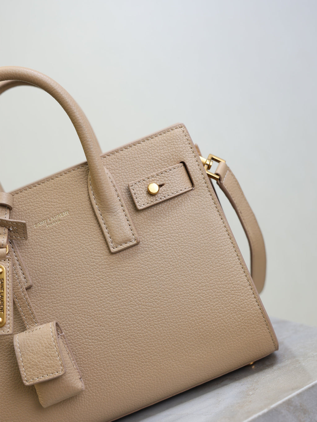 YSL 25S SAC DE JOUR 22 IN DARK BEIGE SUPPLE GRAINED CALFSKIN