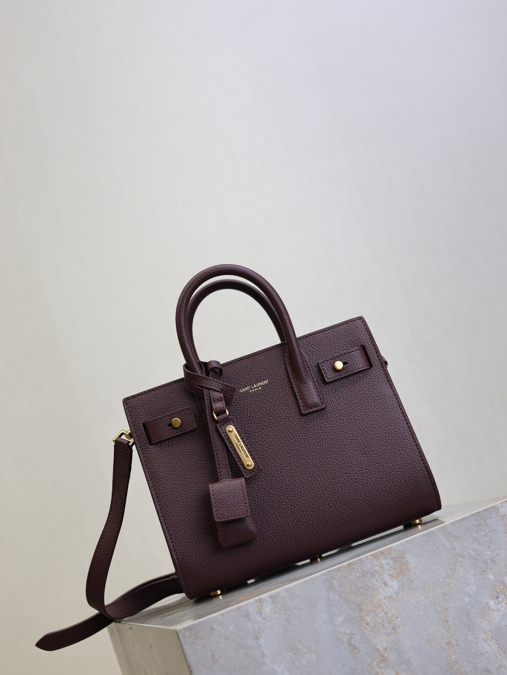 YSL 25S SAC DE JOUR 22 IN ROUGE CABERNET SUPPLE GRAINED CALFSKIN