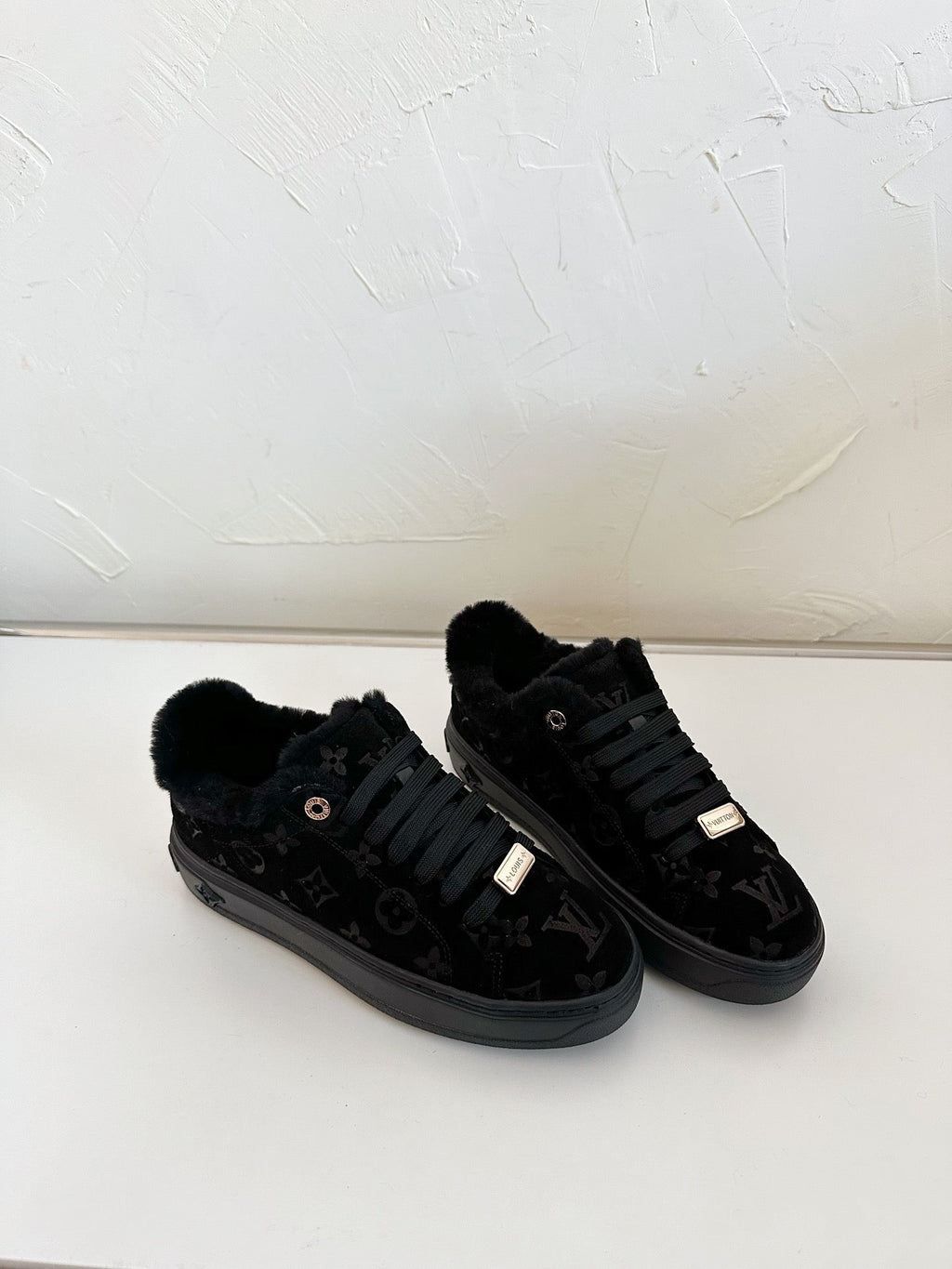 TIME OUT SNEAKER IN BLACK MONOGRAM EMBOSSED SUEDE WITH FLEECE LINING