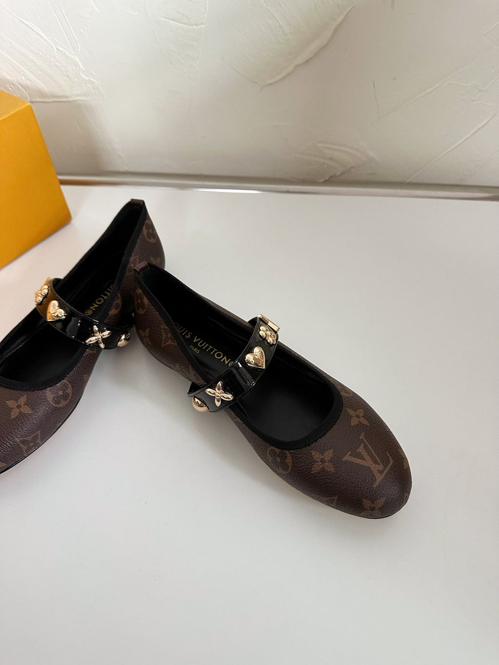 ROMY FLAT BALLERINA IN CHOCOLATE BROWN MONOGRAM CALFSKIN