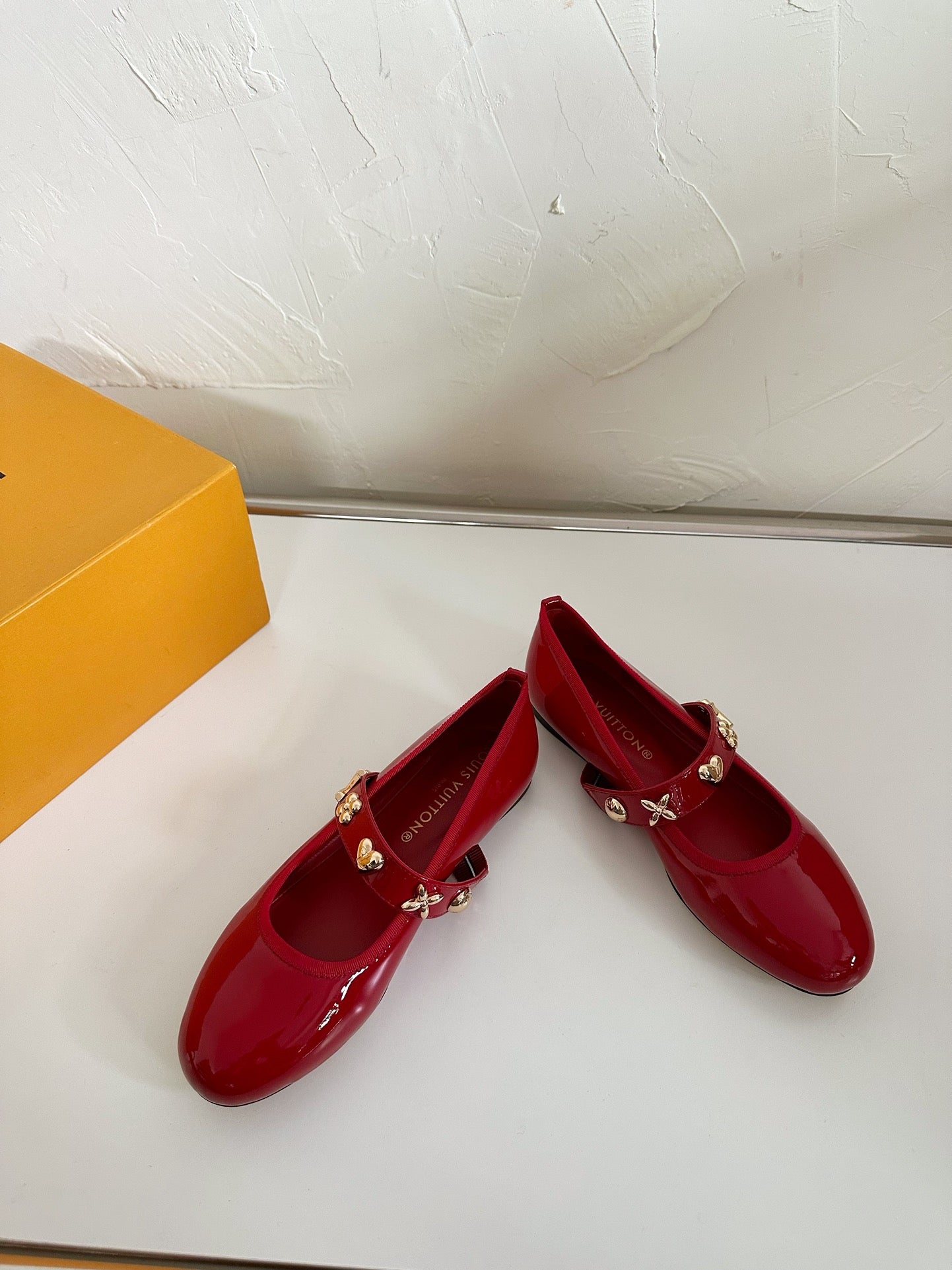 ROMY FLAT BALLERINA IN RUBY RED PATENT CALFSKIN