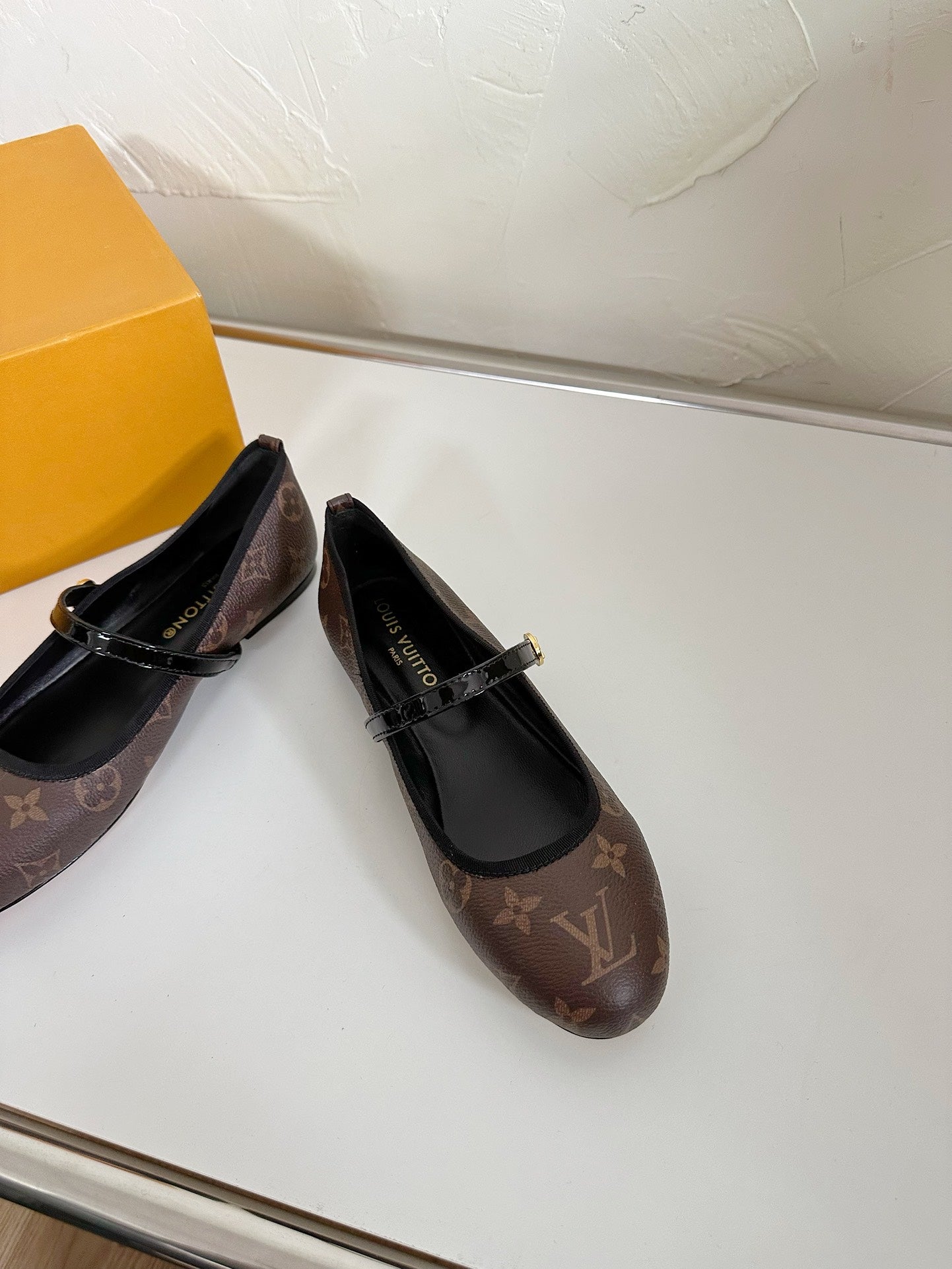 ROMY FLAT BALLERINA IN BROWN MONOGRAM CALFSKIN