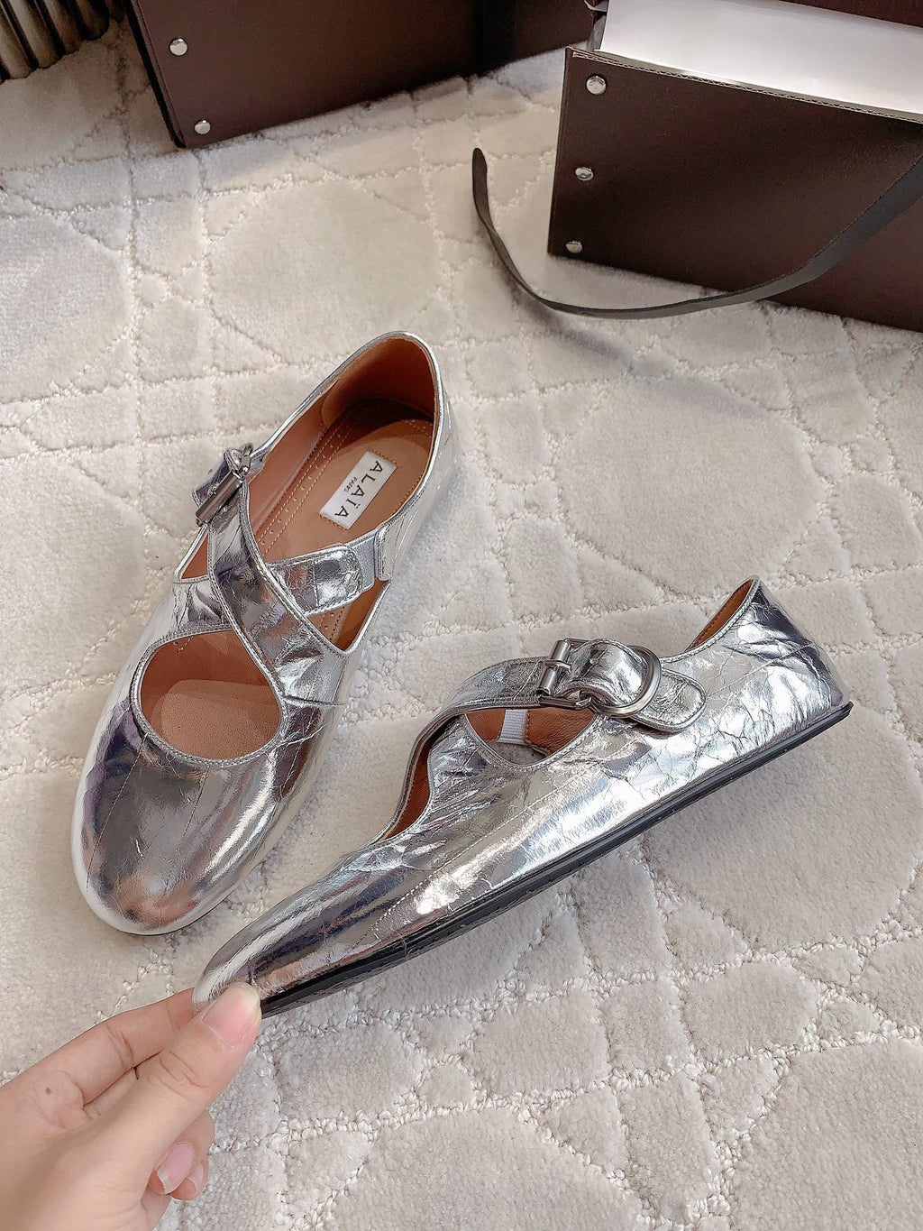 ALAIA CRISS CROSS BALLET FLAT IN SILVER LAMBSKIN