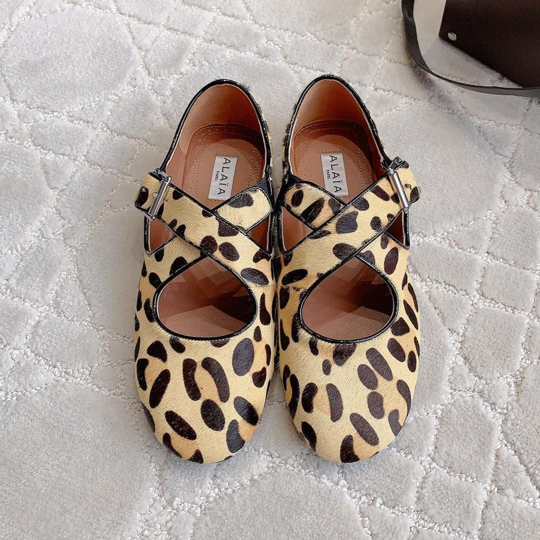 ALAIA CRISS CROSS BALLET FLAT IN LEOPARD LAMBSKIN WITH SILVER HARDWARE