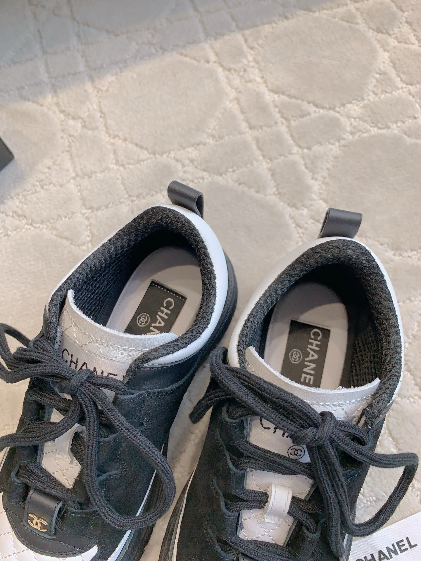 CHANEL 25S TRAINERS 40MM IN BLACK AND WHITE CALFSKIN AND SUEDE