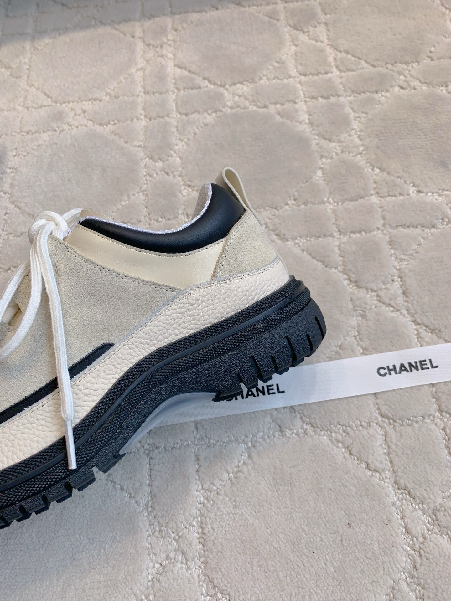CHANEL 25S TRAINERS 40MM IN WHITE AND BLACK CALFSKIN