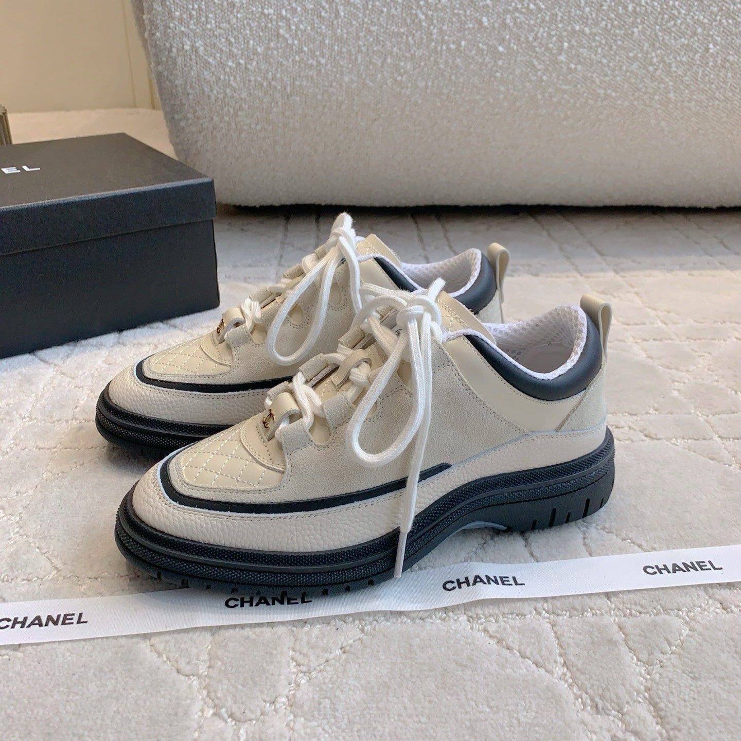 CHANEL 25S TRAINERS 40MM IN WHITE AND BLACK CALFSKIN
