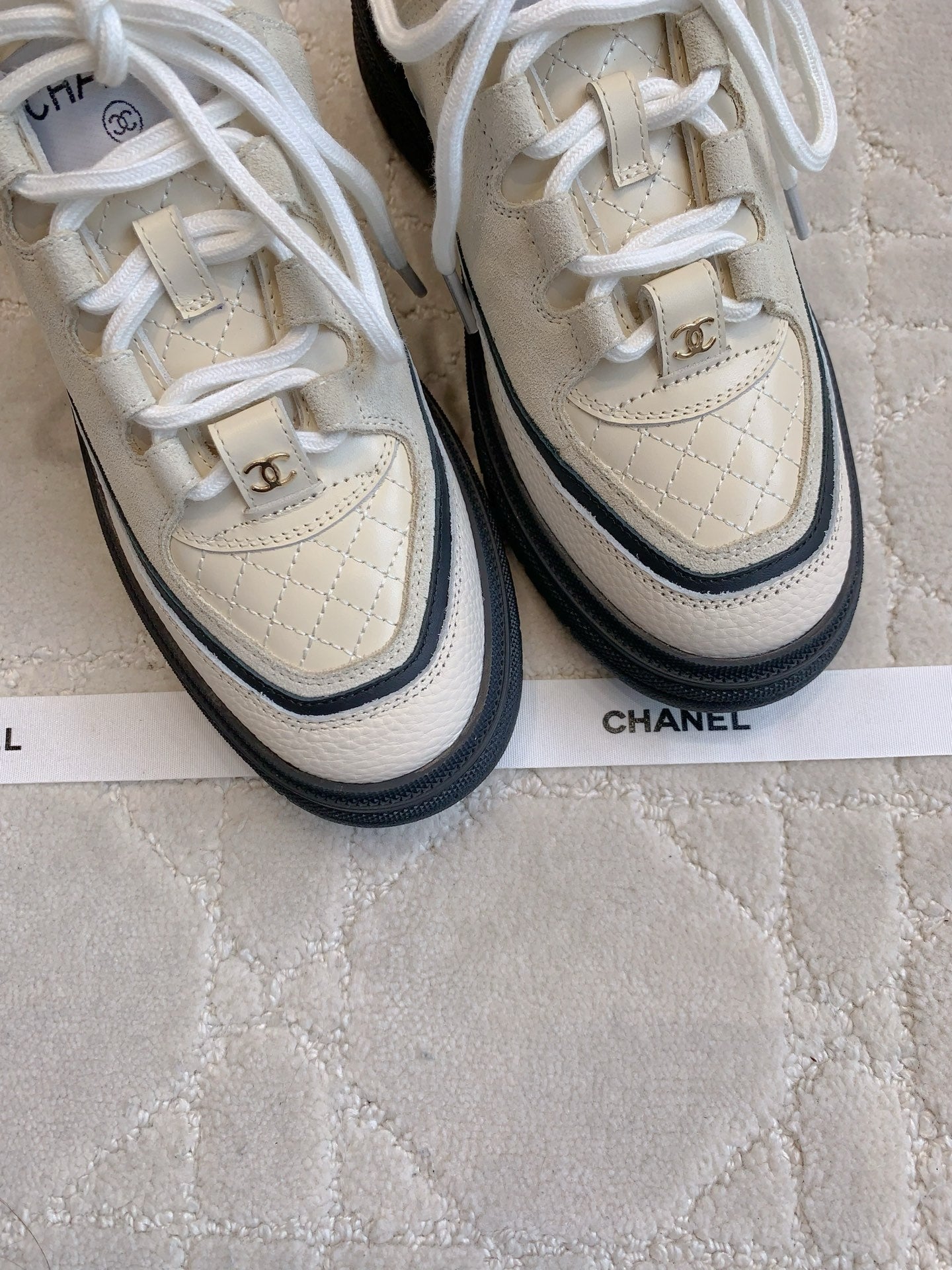 CHANEL 25S TRAINERS 40MM IN WHITE AND BLACK CALFSKIN