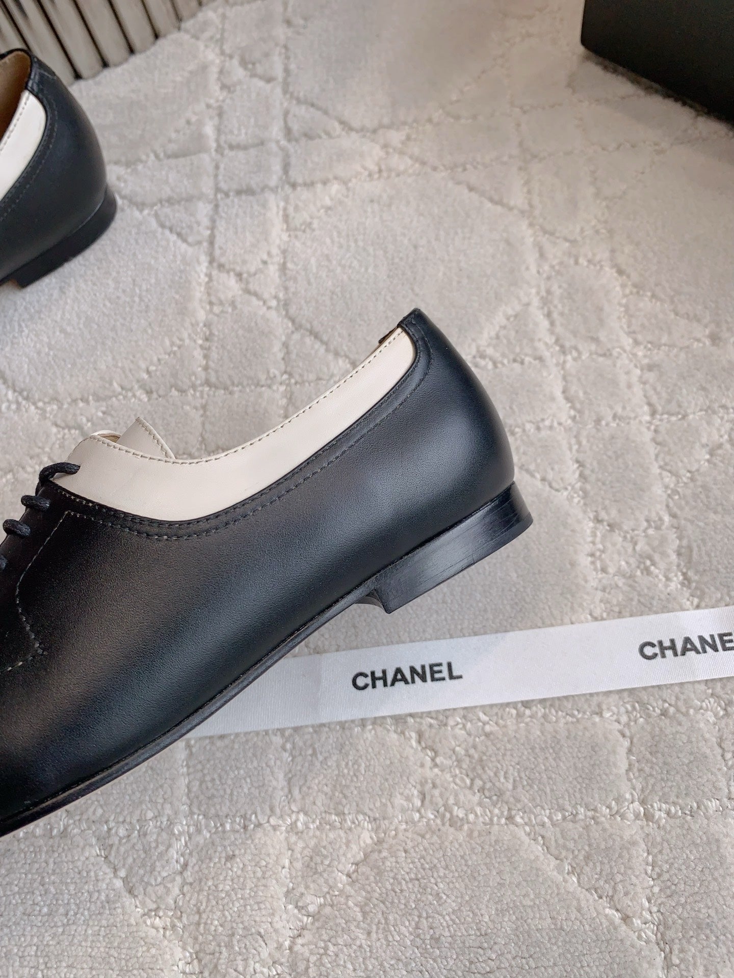 CHANEL 25S TWO TONE LACE UP IN BLACK AND WHITE CALFSKIN