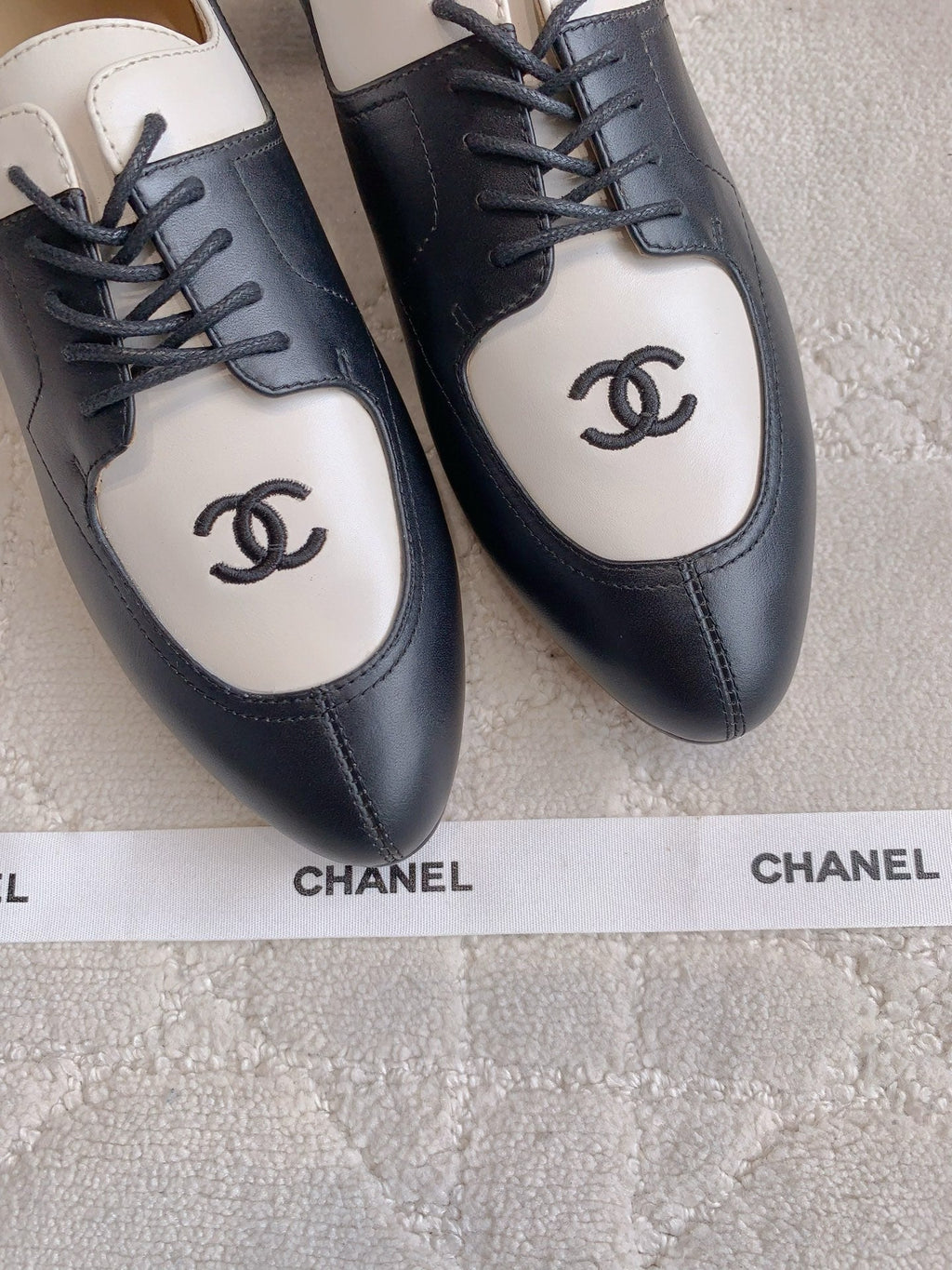 CHANEL 25S TWO TONE LACE UP IN BLACK AND WHITE CALFSKIN